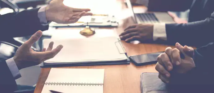 Professionals sitting at a conference table