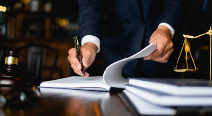 Employment law attorney signing legal documents