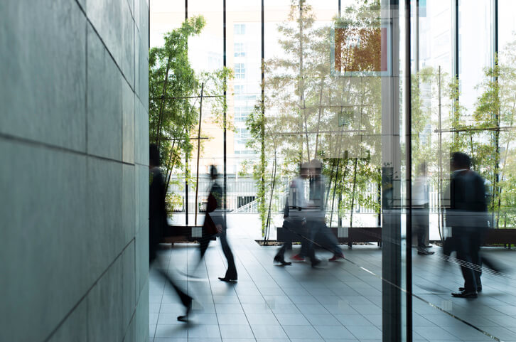 People walking around in an office space